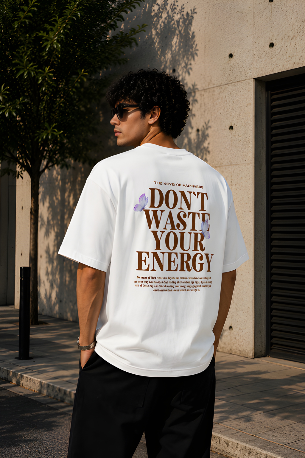 Antim Dont Waste Your Energy Oversized White T-Shirt Back Typography Print Butterfly Drop Shoulder Male Model Outdoor Streetwear India